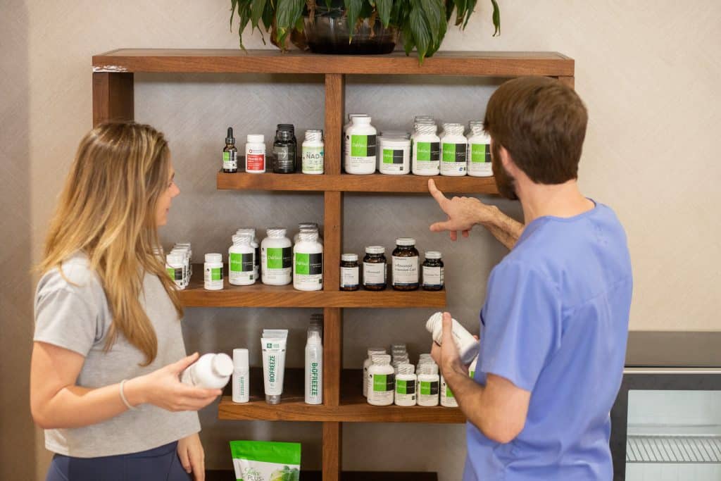 A Medical Weight Loss specialist helps a patient select supplements