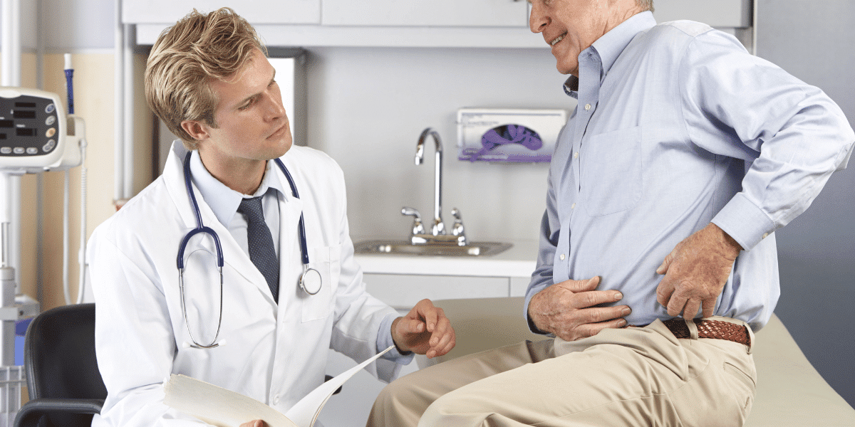 A person being examined by a medical professional for hip pain