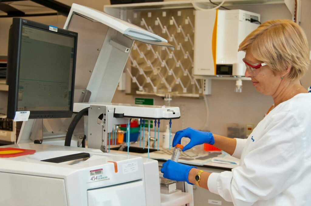 A lab technician preparing a stem cell therapy treatment.